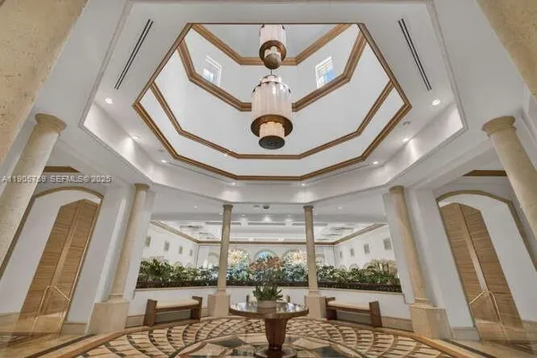 a view of living room with a floor to ceiling window and stairs