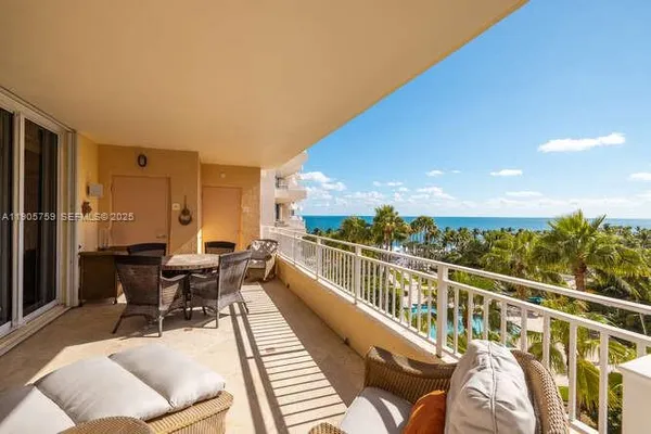 a view of balcony with furniture