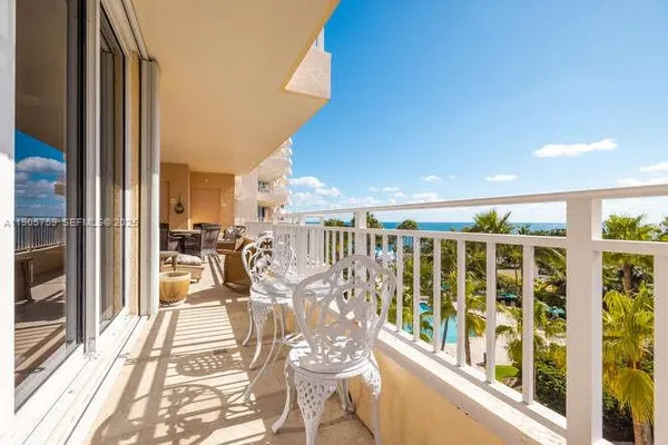 a view of a balcony with chairs