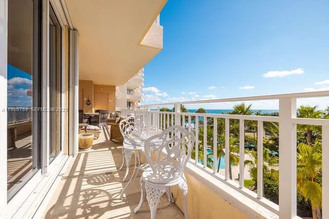 a view of a balcony with chairs