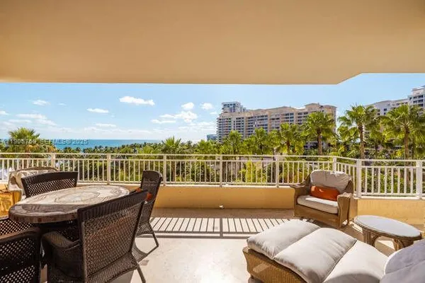 a view of a balcony with furniture