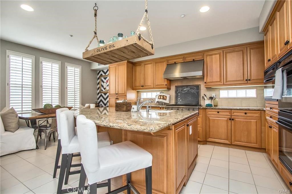 3 Weldon Heights Ladera Ranch, CA 92694 - Photo 5 of 13 a kitchen with stainless steel appliances granite countertop a sink counter space cabinets and a window