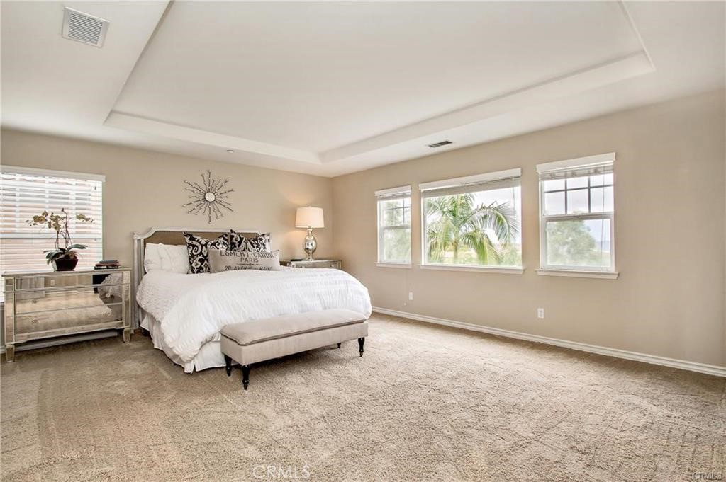 3 Weldon Heights Ladera Ranch, CA 92694 - Photo 9 of 13 a bedroom with a bed lamp and window
