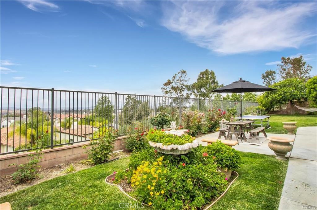 3 Weldon Heights Ladera Ranch, CA 92694 - Photo 10 of 13 a view of a chair and tables in the garden