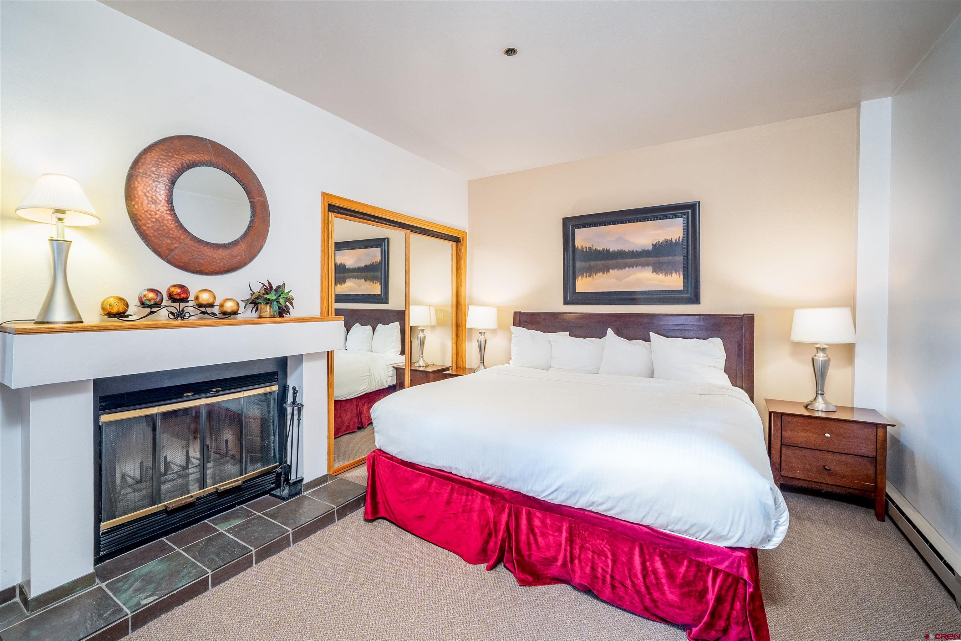 71 East Needles Road, Unit 331 Durango, CO 81301 - Photo 16 of 40 a bedroom with a bed and a fireplace