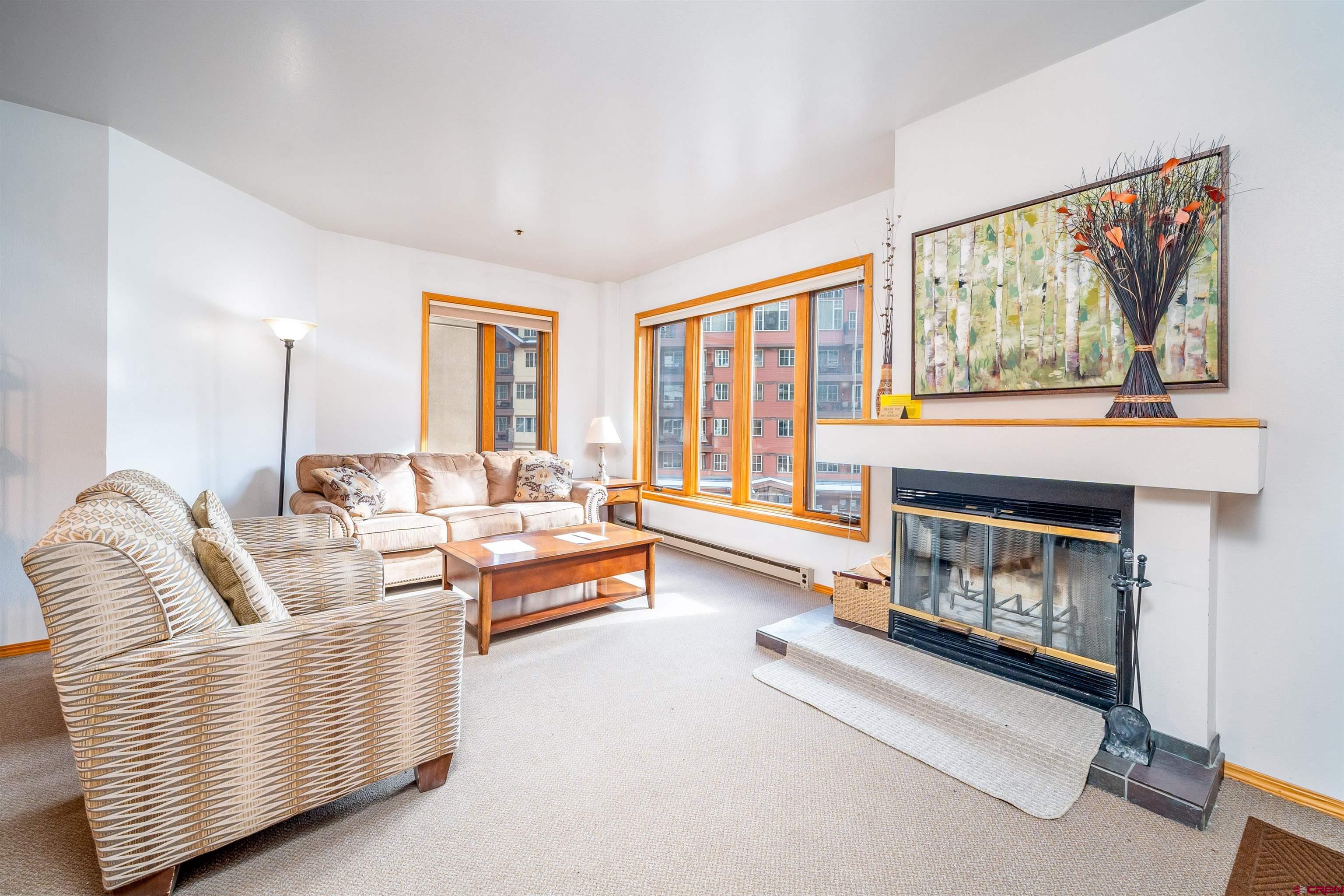 71 East Needles Road, Unit 331 Durango, CO 81301 - Photo 2 of 40 a living room with furniture and a fireplace