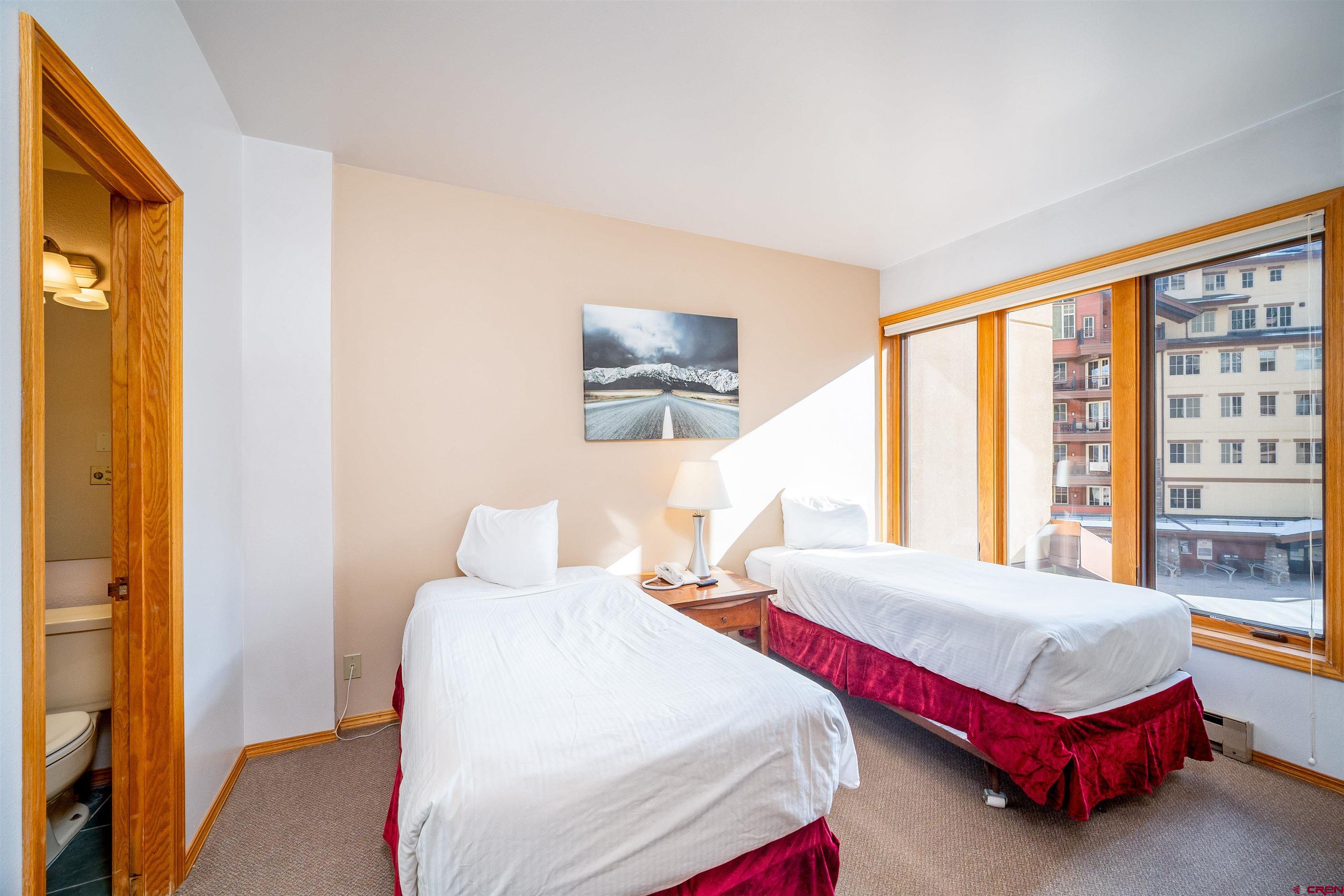 71 East Needles Road, Unit 331 Durango, CO 81301 - Photo 22 of 40 a bedroom with a bed and a window