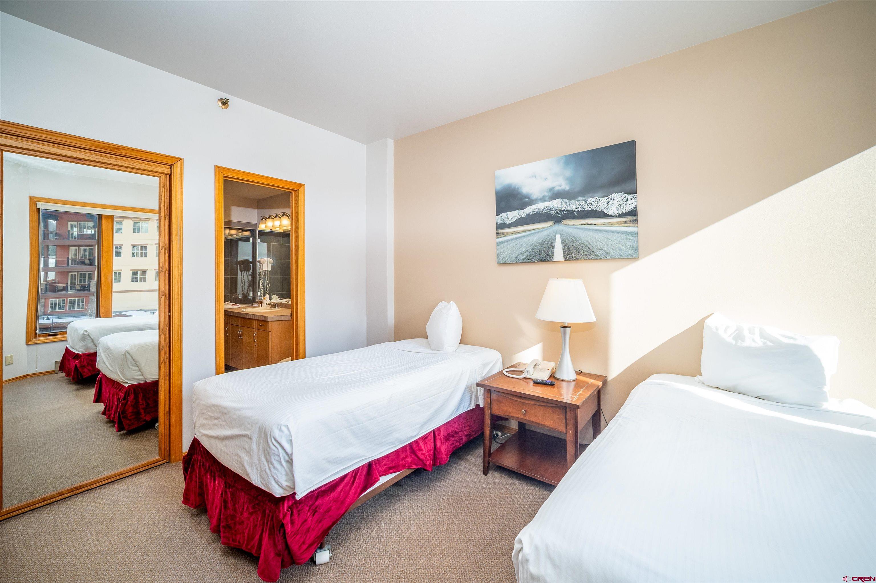 71 East Needles Road, Unit 331 Durango, CO 81301 - Photo 23 of 40 a bedroom with a bed and a couch