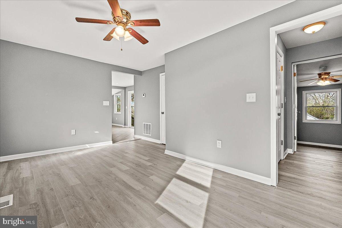 22310 Clarksburg Road Boyds, MD 20841 - Photo 11 of 47 wooden floor in an empty room with a window