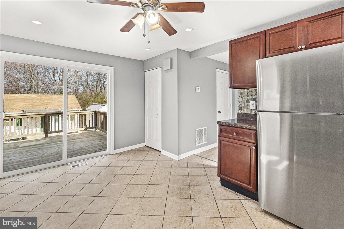 22310 Clarksburg Road Boyds, MD 20841 - Photo 14 of 47 a kitchen with stainless steel appliances a refrigerator and microwave