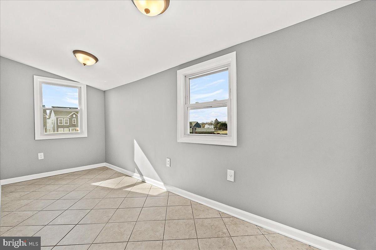 22310 Clarksburg Road Boyds, MD 20841 - Photo 17 of 47 a view of a room with wooden floor and window