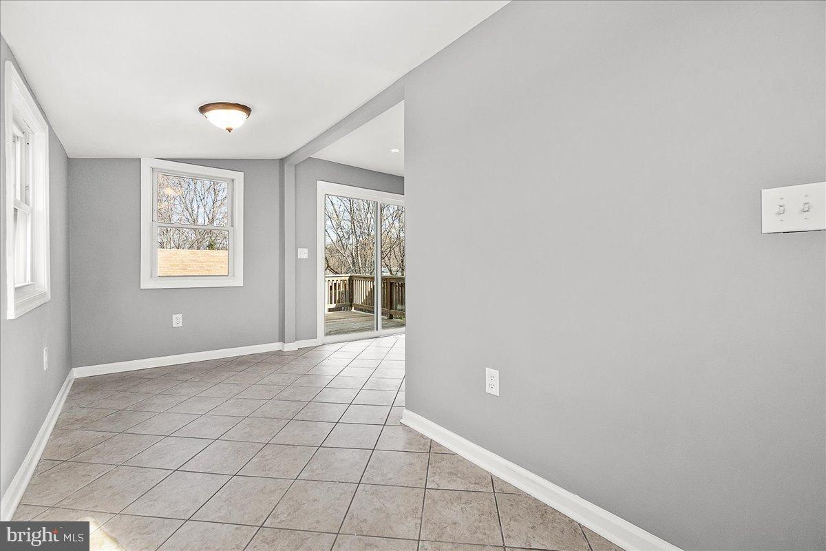 22310 Clarksburg Road Boyds, MD 20841 - Photo 18 of 47 a view of an empty room with window and closet area