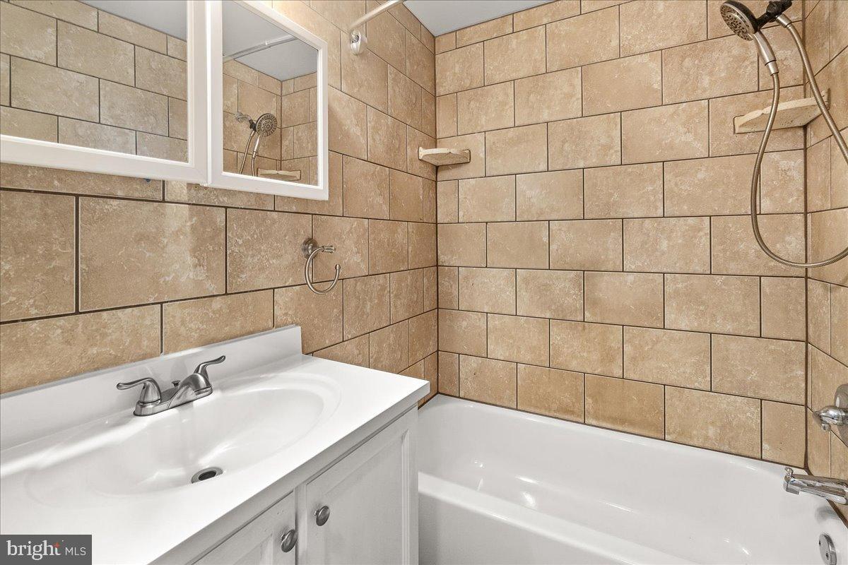 22310 Clarksburg Road Boyds, MD 20841 - Photo 20 of 47 a bathroom with a sink and a bathtub