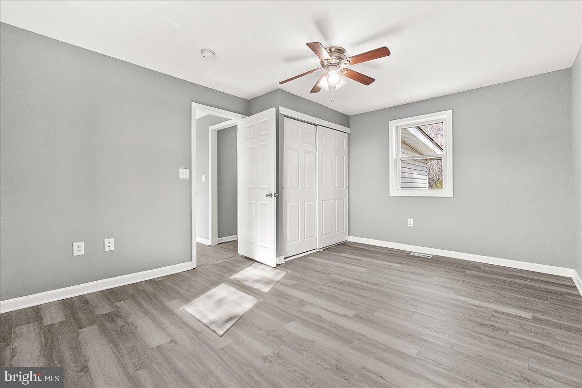 22310 Clarksburg Road Boyds, MD 20841 - Photo 21 of 47 wooden floor in an empty room with a window