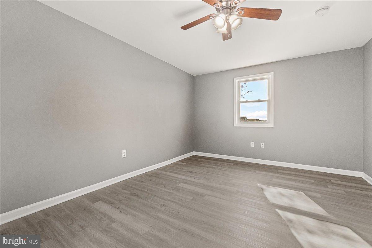 22310 Clarksburg Road Boyds, MD 20841 - Photo 22 of 47 wooden floor in an empty room with a window