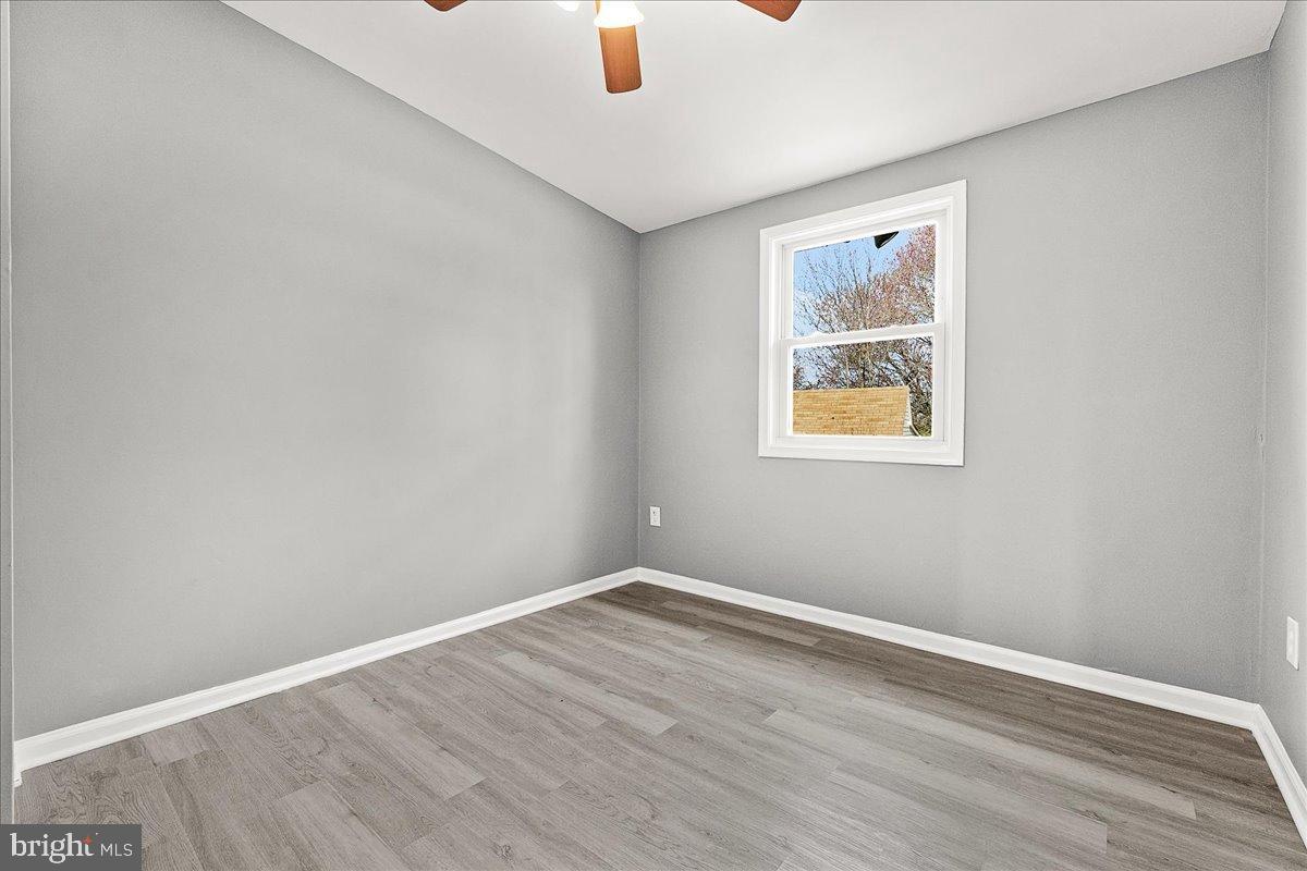 22310 Clarksburg Road Boyds, MD 20841 - Photo 23 of 47 an empty room with a window and a ceiling fan