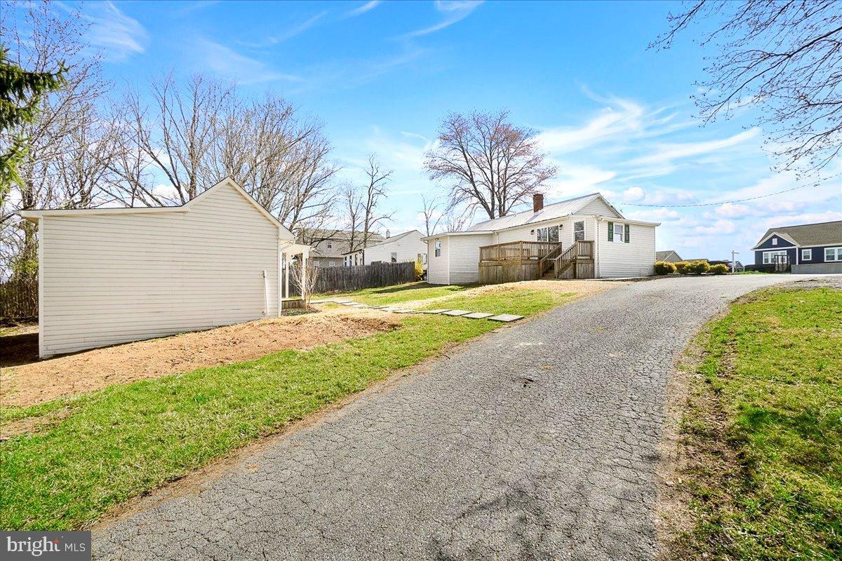 22310 Clarksburg Road Boyds, MD 20841 - Photo 30 of 47 a front view of a house with a yard and garage