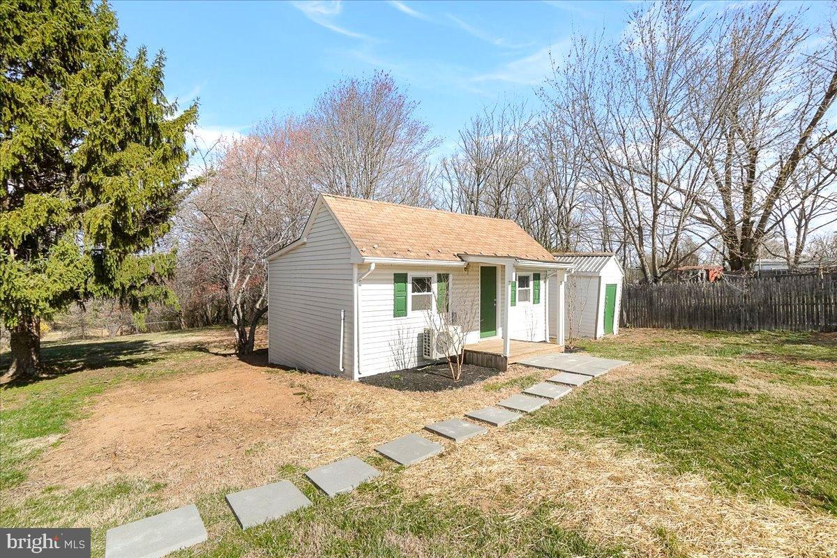 22310 Clarksburg Road Boyds, MD 20841 - Photo 31 of 47 a front view of a house with a yard and trees