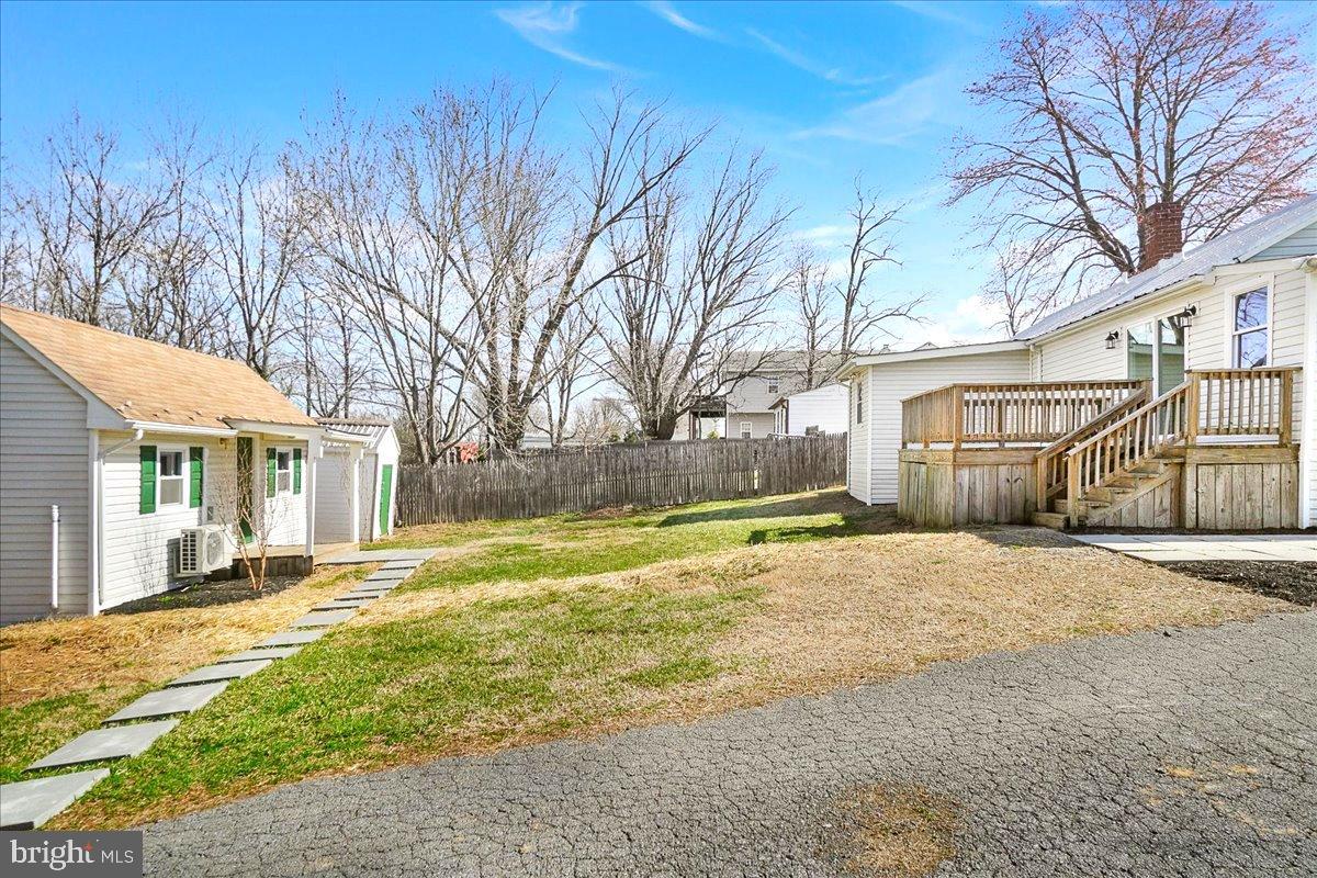 22310 Clarksburg Road Boyds, MD 20841 - Photo 4 of 47 a yellow house with trees in front of it