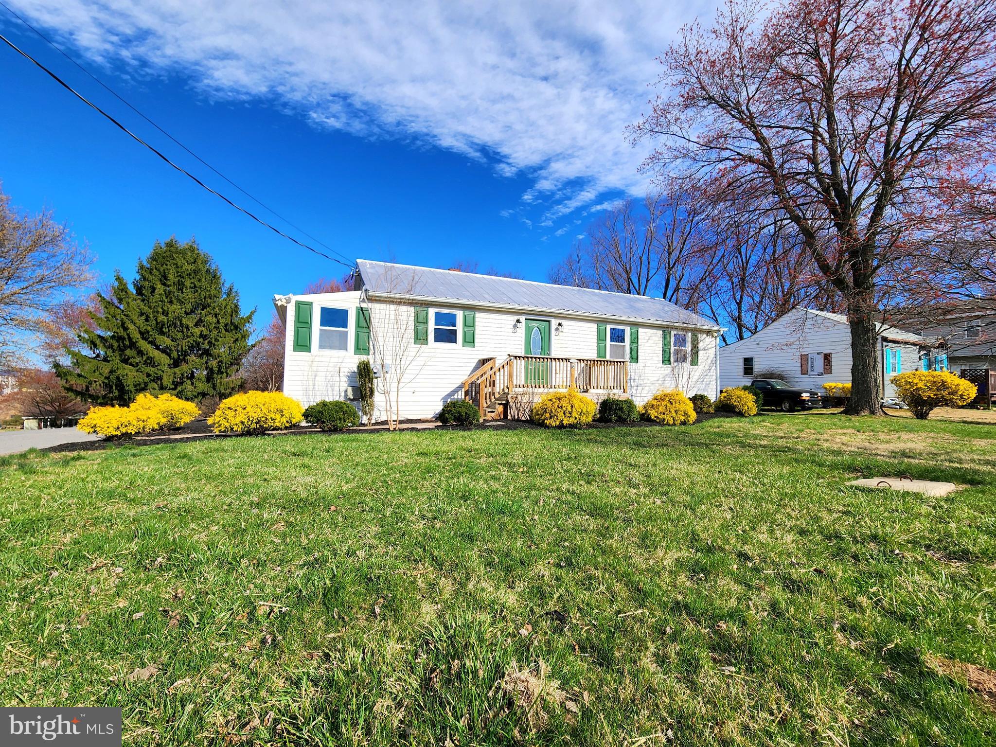 22310 Clarksburg Road Boyds, MD 20841 - Photo 5 of 47 a front view of a house with garden