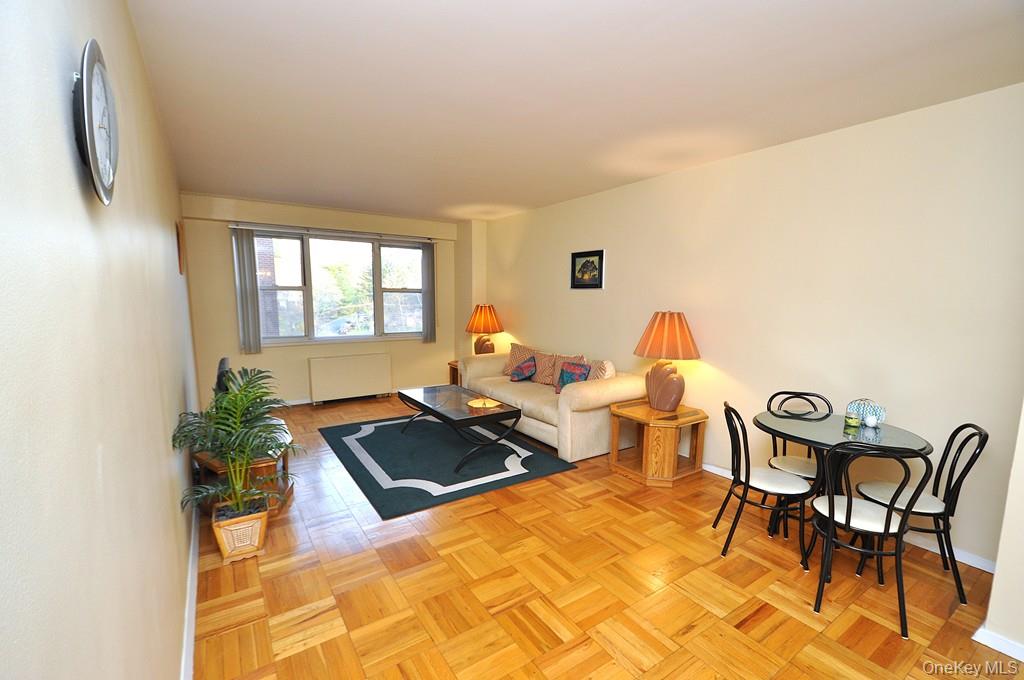 260 Garth Road, Unit 4A5 Scarsdale, NY 10583 - Photo 1 of 35 a living room with furniture and a potted plant