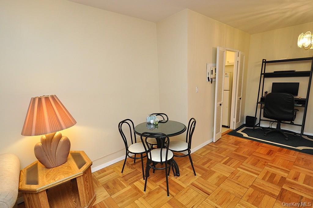 260 Garth Road, Unit 4A5 Scarsdale, NY 10583 - Photo 15 of 35 a view of a workspace with furniture and a mirror