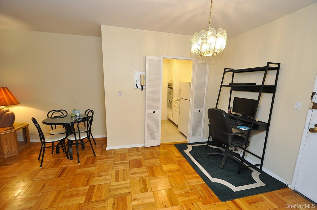 260 Garth Road, Unit 4A5 Scarsdale, NY 10583 - Photo 19 of 35 a view of a dining room with furniture
