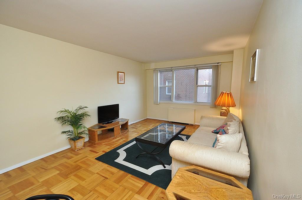 260 Garth Road, Unit 4A5 Scarsdale, NY 10583 - Photo 4 of 35 a bedroom with a bed and a window