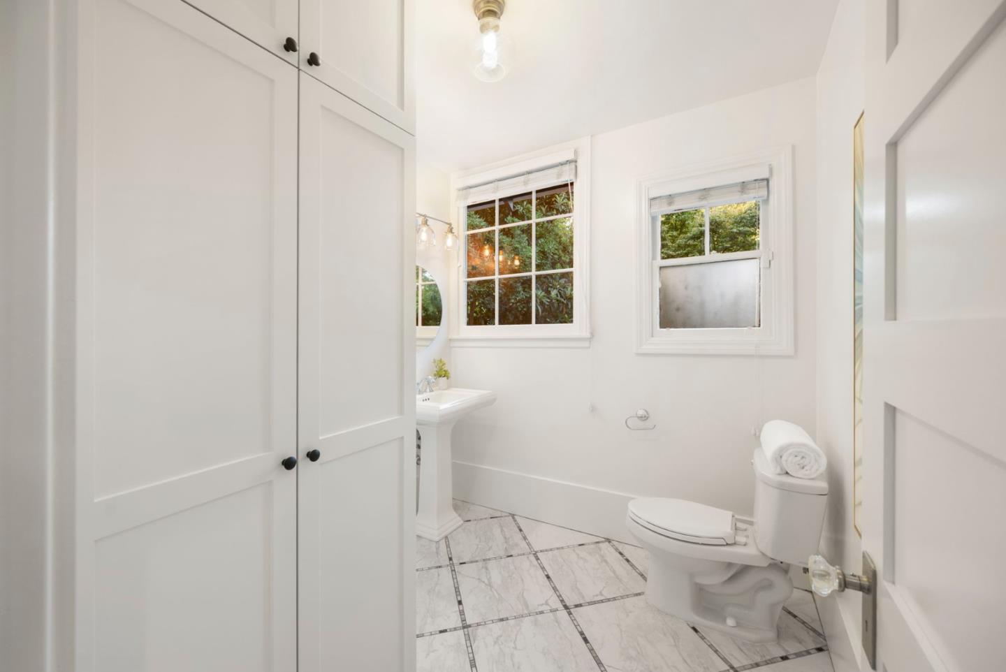 445 Arlington Road Redwood City, CA 94062 - Photo 14 of 50 a bathroom with a toilet a sink and a window