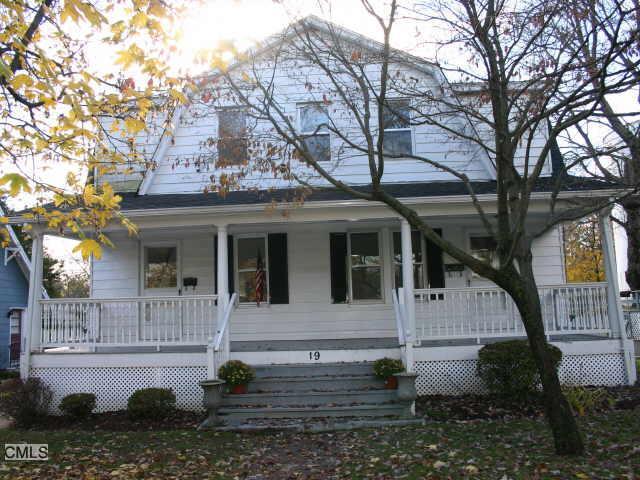 19 Chestnut Street Darien, CT 06820 - Photo 1 of 1 a view of a house with brick walls plants and large tree