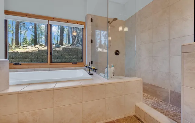 a bathroom with a double vanity sink and mirror