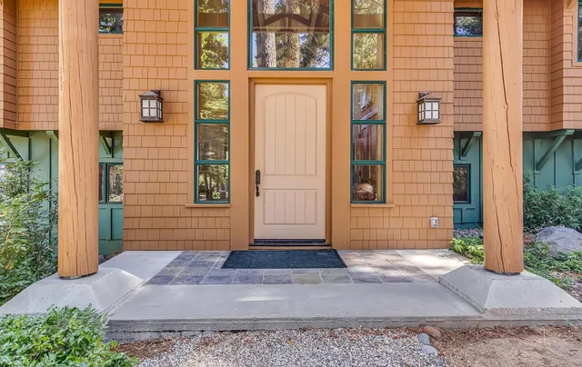 a view of a brick house with many windows