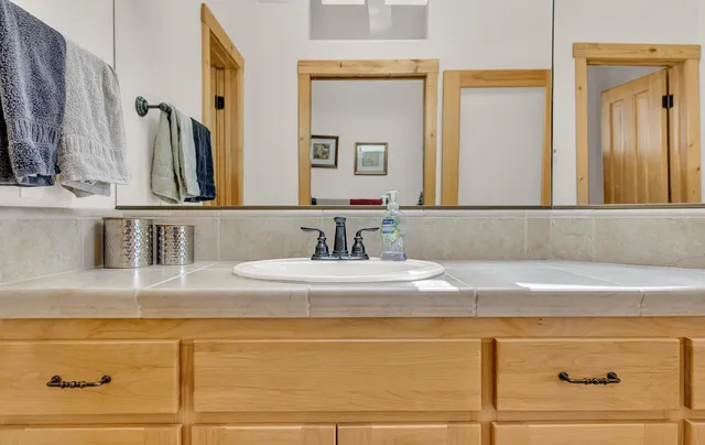 a bathroom with a sink and a mirror