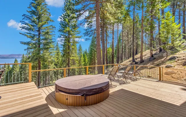 a view of balcony with wooden floor and outdoor seating