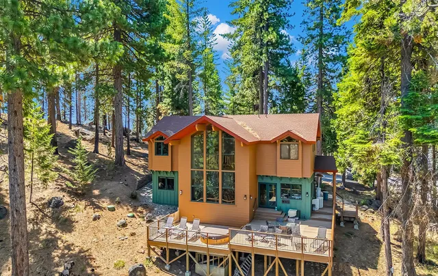 a view of a patio with table and chairs and potted plants