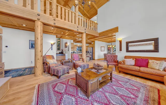a living room with furniture and a book shelf