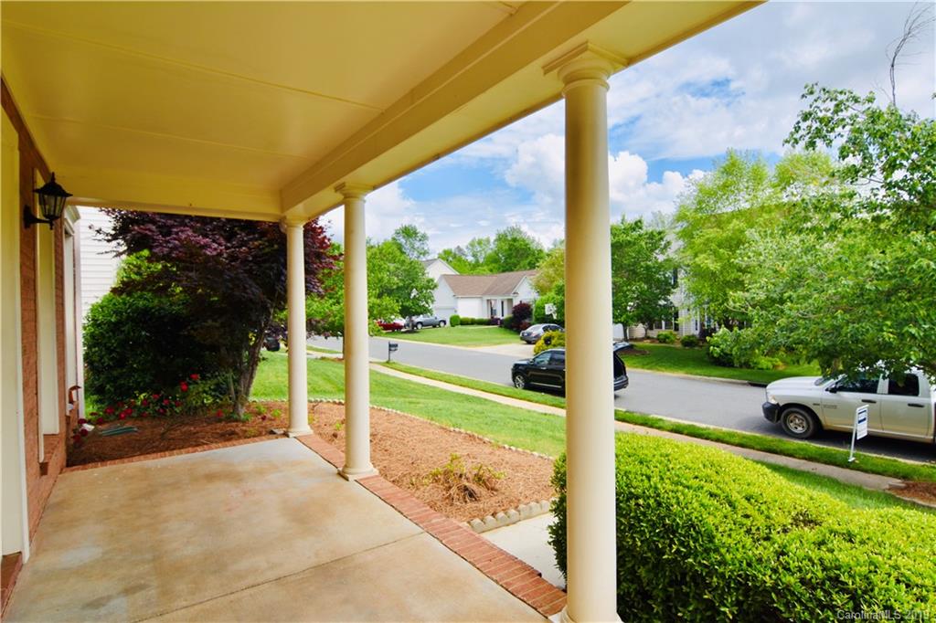 509 Circle Trace Road Monroe, NC 28110 - Photo 2 of 36 a view of a porch with furniture and garden