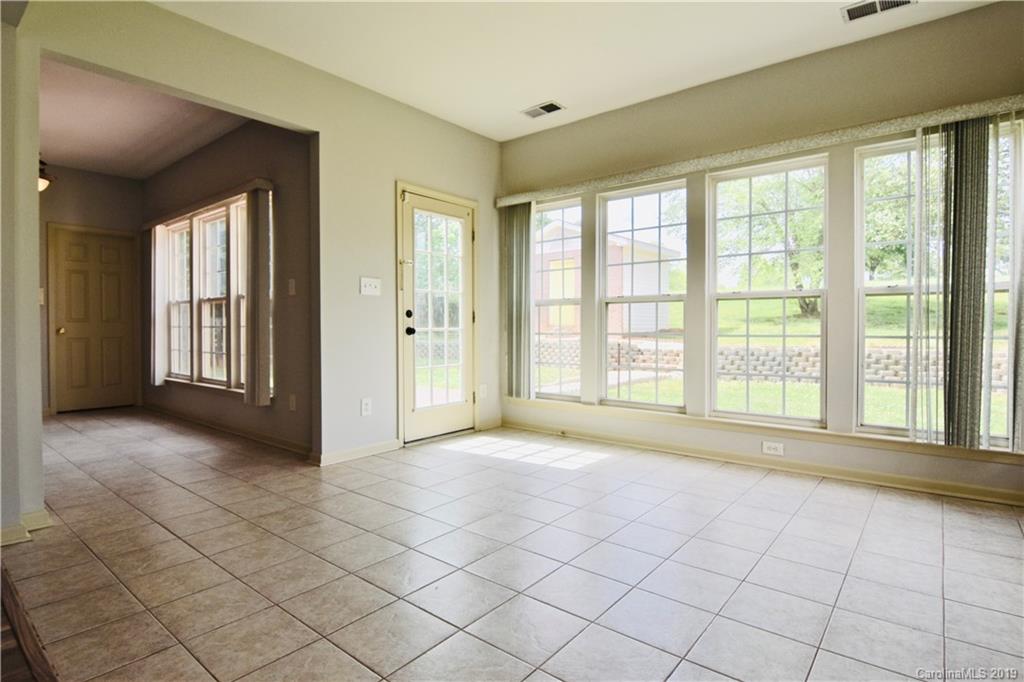 509 Circle Trace Road Monroe, NC 28110 - Photo 15 of 36 a view of an empty room with window and a kitchen