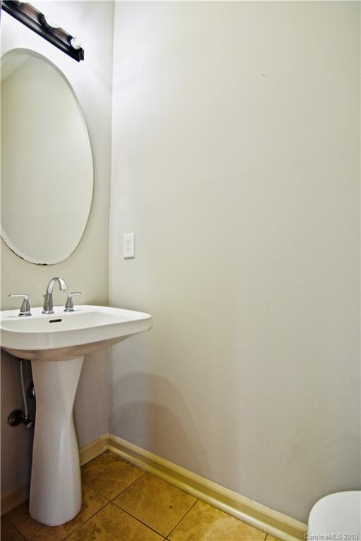 509 Circle Trace Road Monroe, NC 28110 - Photo 18 of 36 a bathroom with a sink and mirror