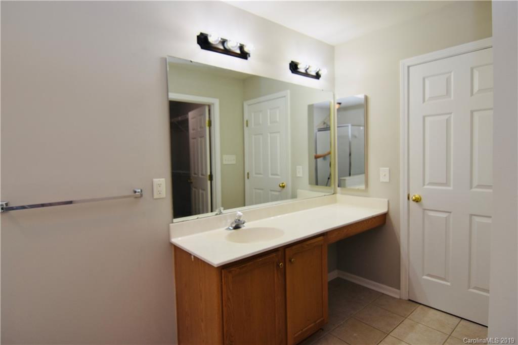 509 Circle Trace Road Monroe, NC 28110 - Photo 22 of 36 a bathroom with a sink and a mirror