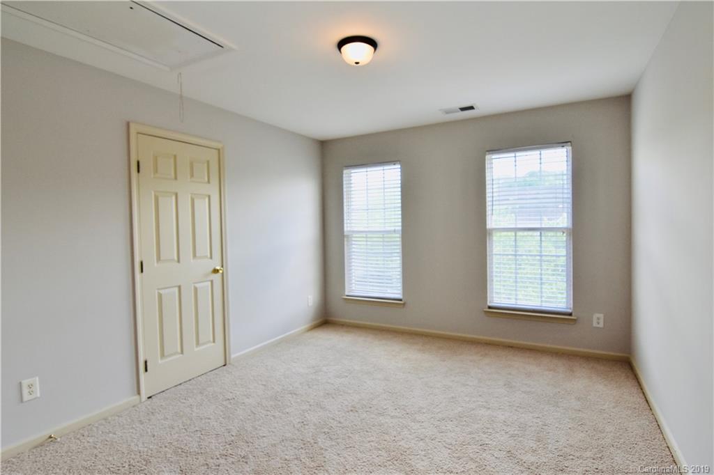 509 Circle Trace Road Monroe, NC 28110 - Photo 27 of 36 an empty room with windows