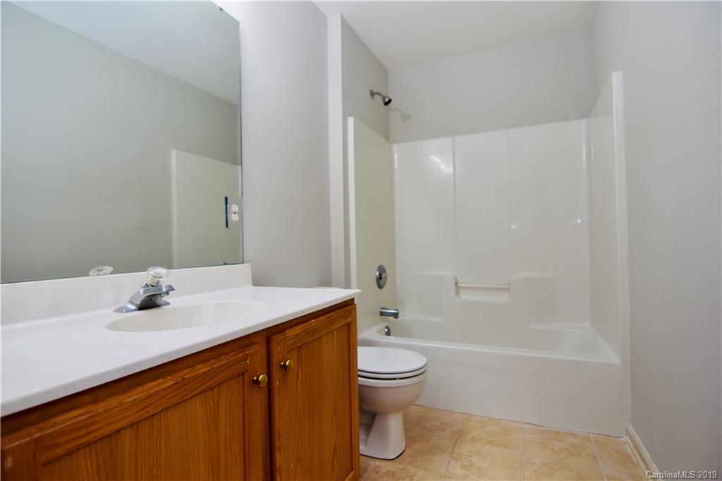 509 Circle Trace Road Monroe, NC 28110 - Photo 28 of 36 a bathroom with a sink a toilet and shower