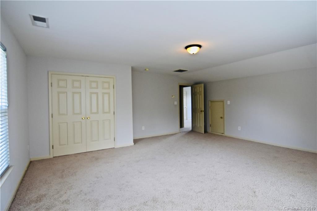 509 Circle Trace Road Monroe, NC 28110 - Photo 32 of 36 an empty room with an entryway and closet area