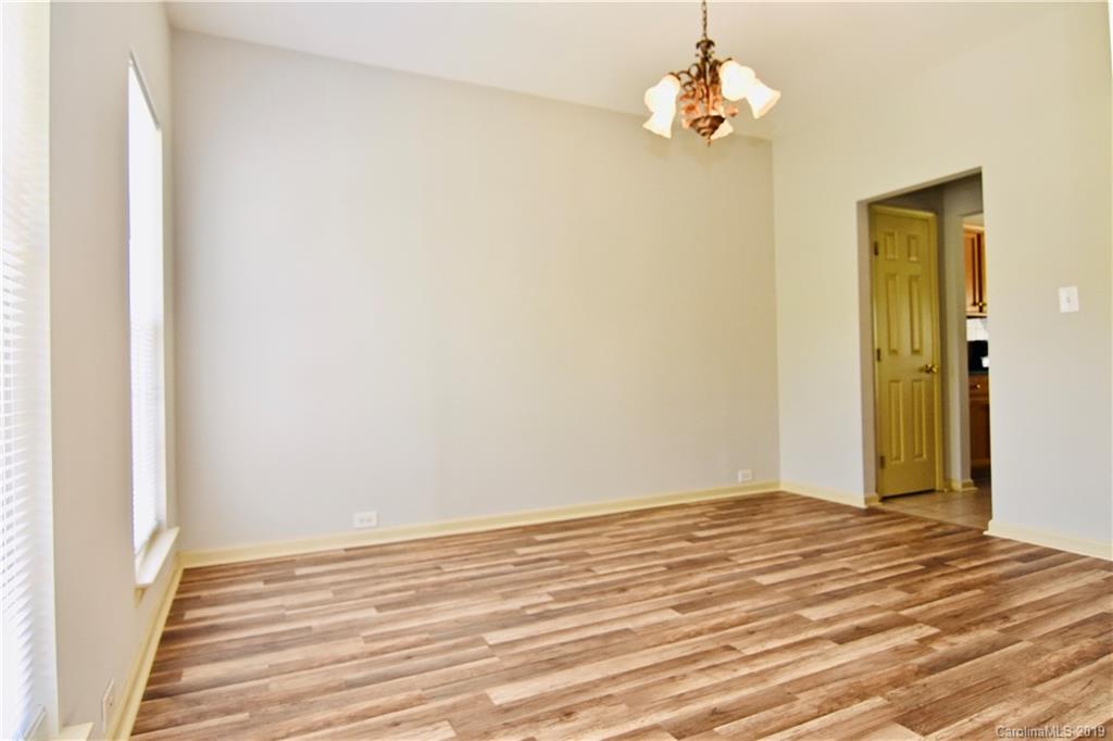 509 Circle Trace Road Monroe, NC 28110 - Photo 6 of 36 a view of a room with wooden floor and ceiling fan