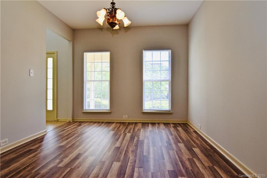 509 Circle Trace Road Monroe, NC 28110 - Photo 7 of 36 wooden floor in an empty room with a window