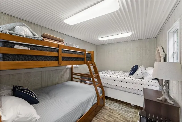 a bedroom with furniture and a window