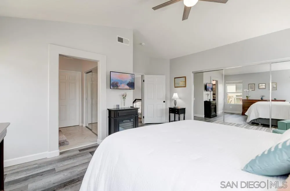 963 Martinique Drive Chula Vista, CA 91913 - Photo 20 of 37 a bedroom with a bed and a chandelier