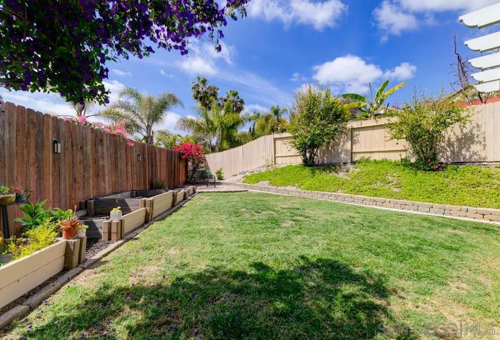 963 Martinique Drive Chula Vista, CA 91913 - Photo 30 of 37 a view of a house with a yard and a garden
