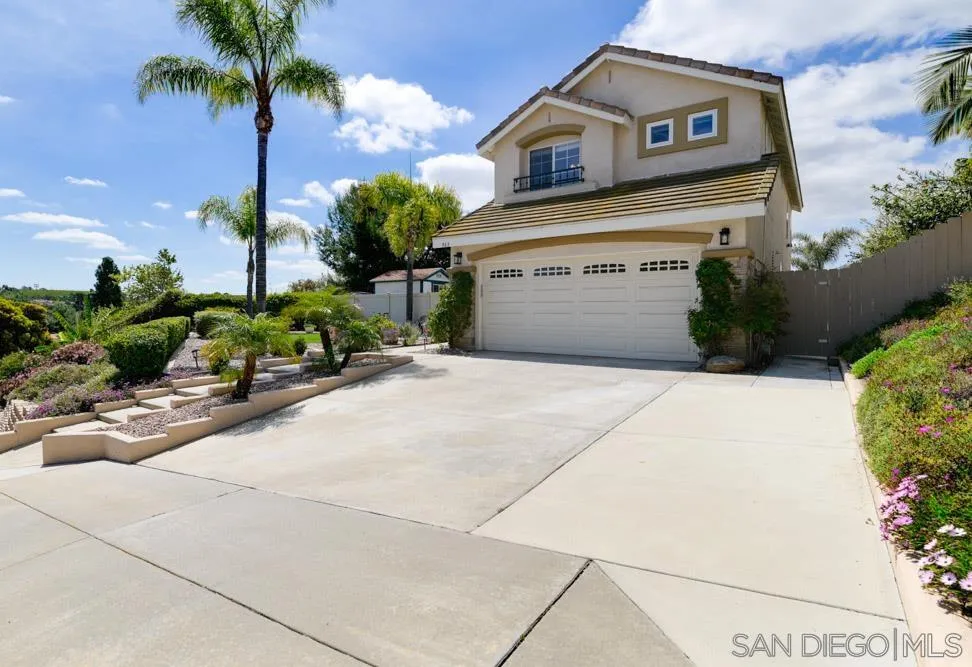 963 Martinique Drive Chula Vista, CA 91913 - Photo 3 of 37 a front view of a house with a garage