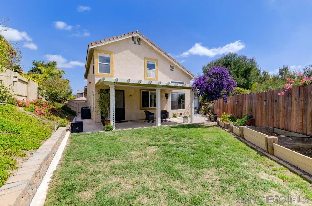 963 Martinique Drive Chula Vista, CA 91913 - Photo 32 of 37 a view of a house with backyard sitting area and garden